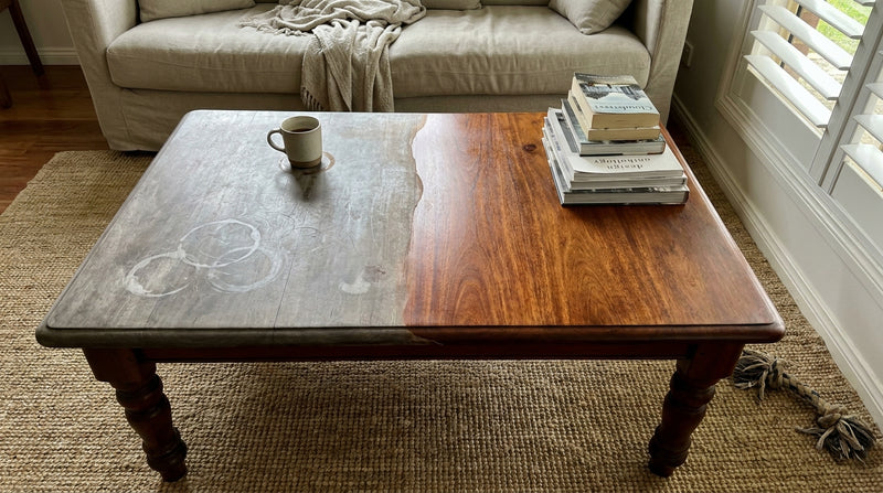 Antique coffee table showing half untreated and half restored
